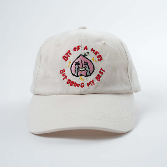 "Bit of a Mess, But Doing My Best" Embroidered Baseball Hat: A Chaotic Comfort Staple